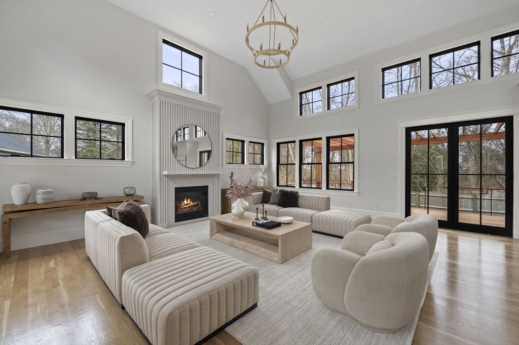16 Liberty Road Marblehead, MA 01945 - Photo 7 of 42 a living room with furniture a large window and a fireplace
