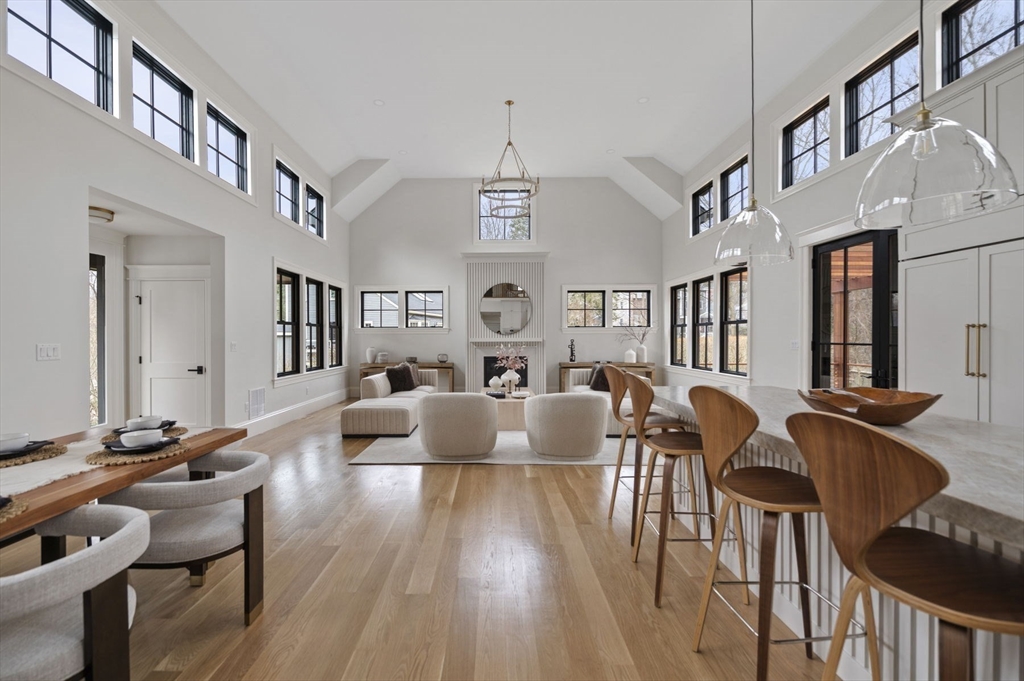 16 Liberty Road Marblehead, MA 01945 - Photo 9 of 42 a living room with fireplace furniture and a wooden floor