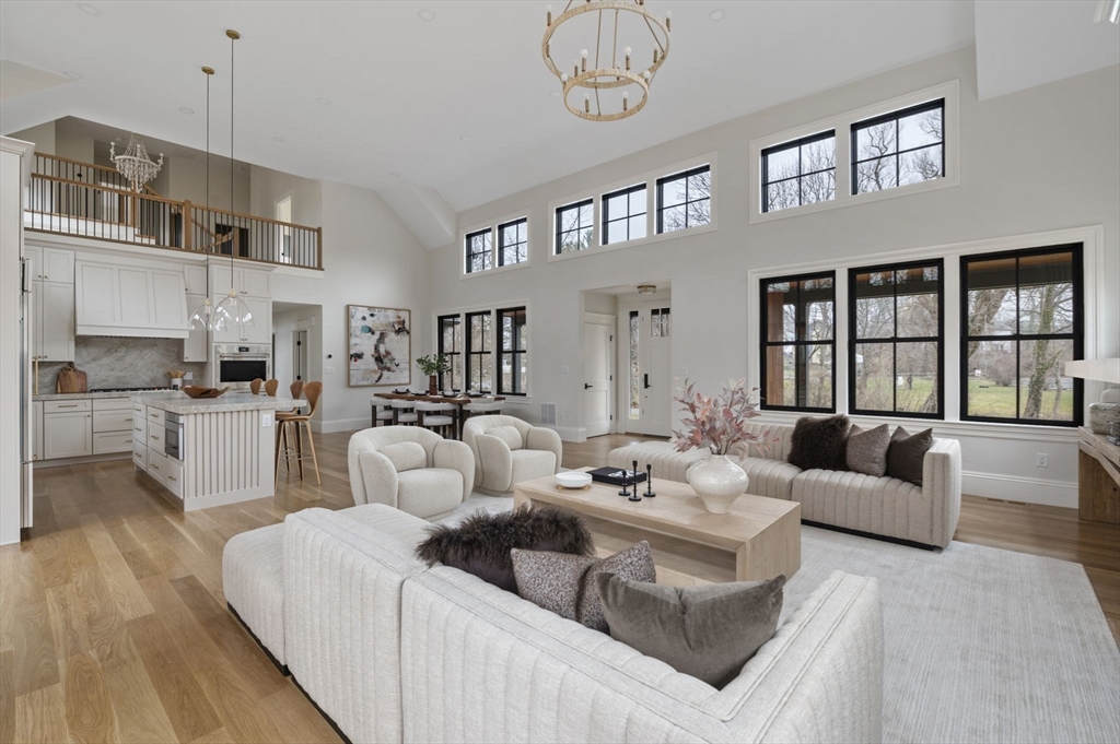 16 Liberty Road Marblehead, MA 01945 - Photo 10 of 42 a living room with furniture fireplace and a large window