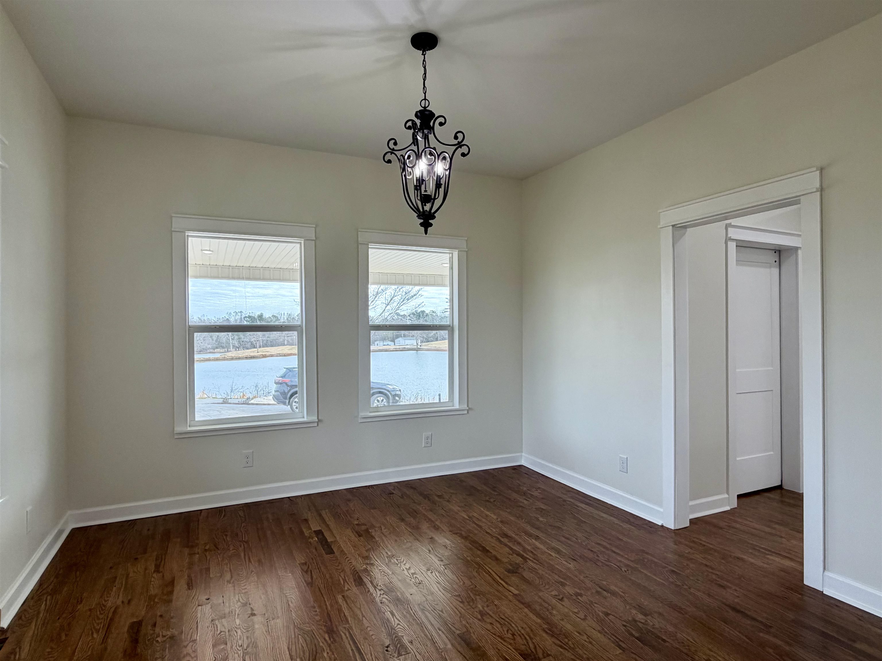 172 New Bethel Road Selmer, TN 38375 - Photo 17 of 30 a view of an empty room with wooden floor and a window