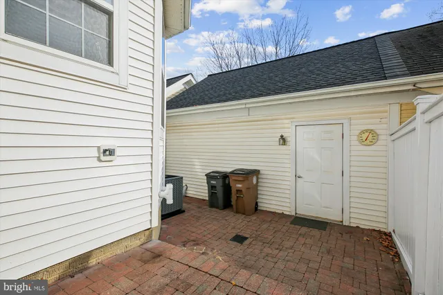 a view of a hallway with wooden floor and entryway