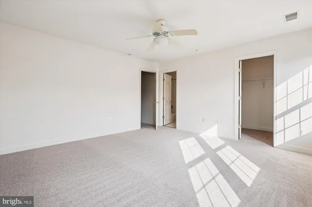 a bathroom with a sink toilet and a mirror