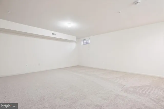 a view of a cafe with sitting area