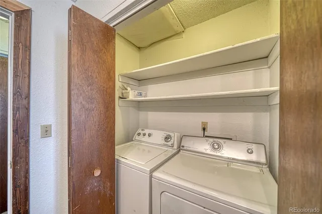 a view of a city with mountains ocean from a terrace