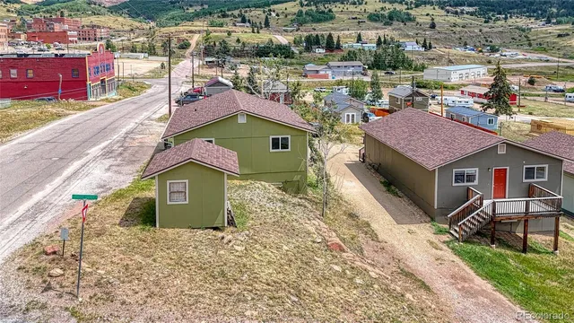 an aerial view of residential houses and outdoor space