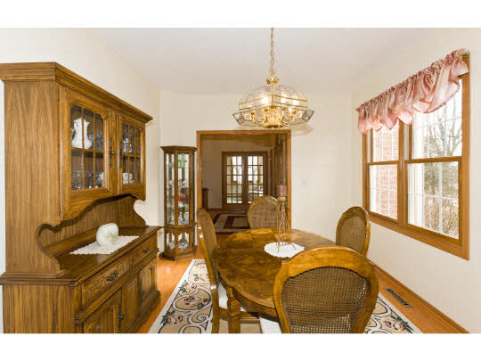 14377 Murphy Road Winnebago, IL 61088 - Photo 10 of 11 a living room with furniture and a chandelier