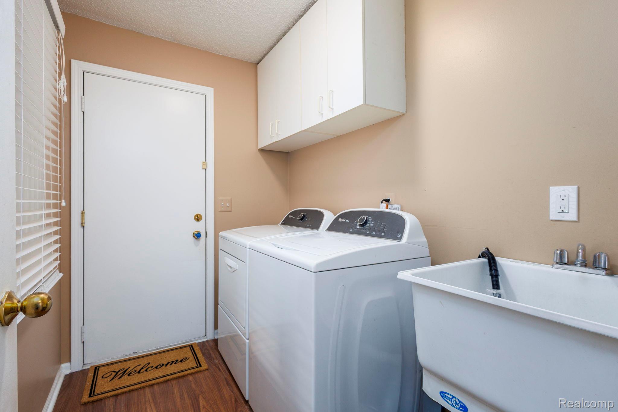 22010 River Ridge Trail Farmington, MI 48335 - Photo 14 of 35 Laundry area off of garage entrance