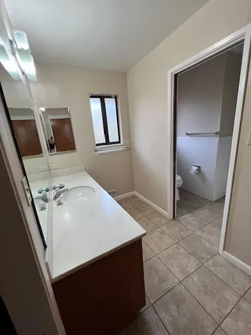 a bathroom with a sink and mirror