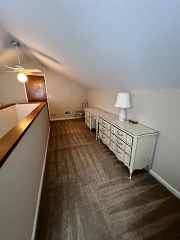 a view of a room with stairs and a couch