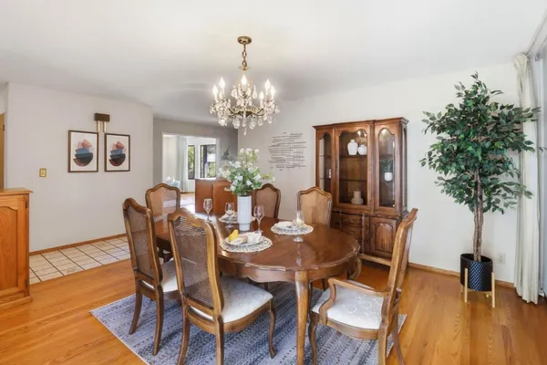 a kitchen with a sink window and cabinets