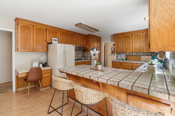 a kitchen with stainless steel appliances granite countertop a sink and cabinets