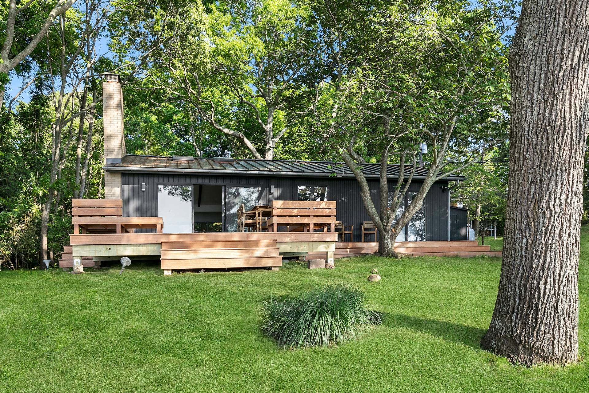 33 Bluff Point Road Sag Harbor, NY 11963 - Photo 15 of 20 a front view of a house with garden