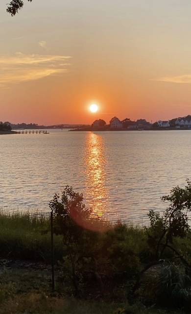 33 Bluff Point Road Sag Harbor, NY 11963 - Photo 19 of 20 a view of a lake from a yard