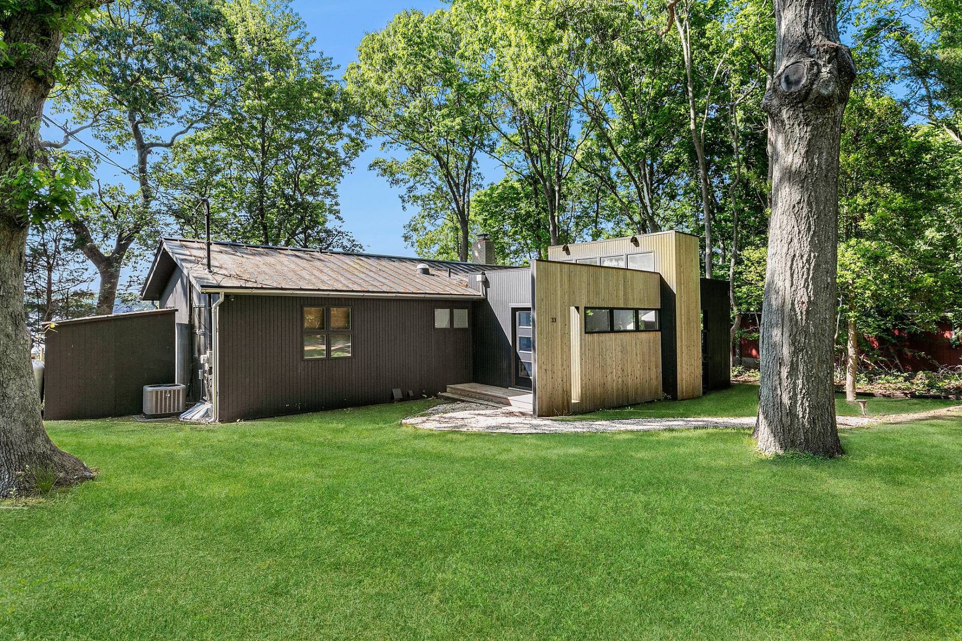 33 Bluff Point Road Sag Harbor, NY 11963 - Photo 2 of 20 a view of a house with a yard