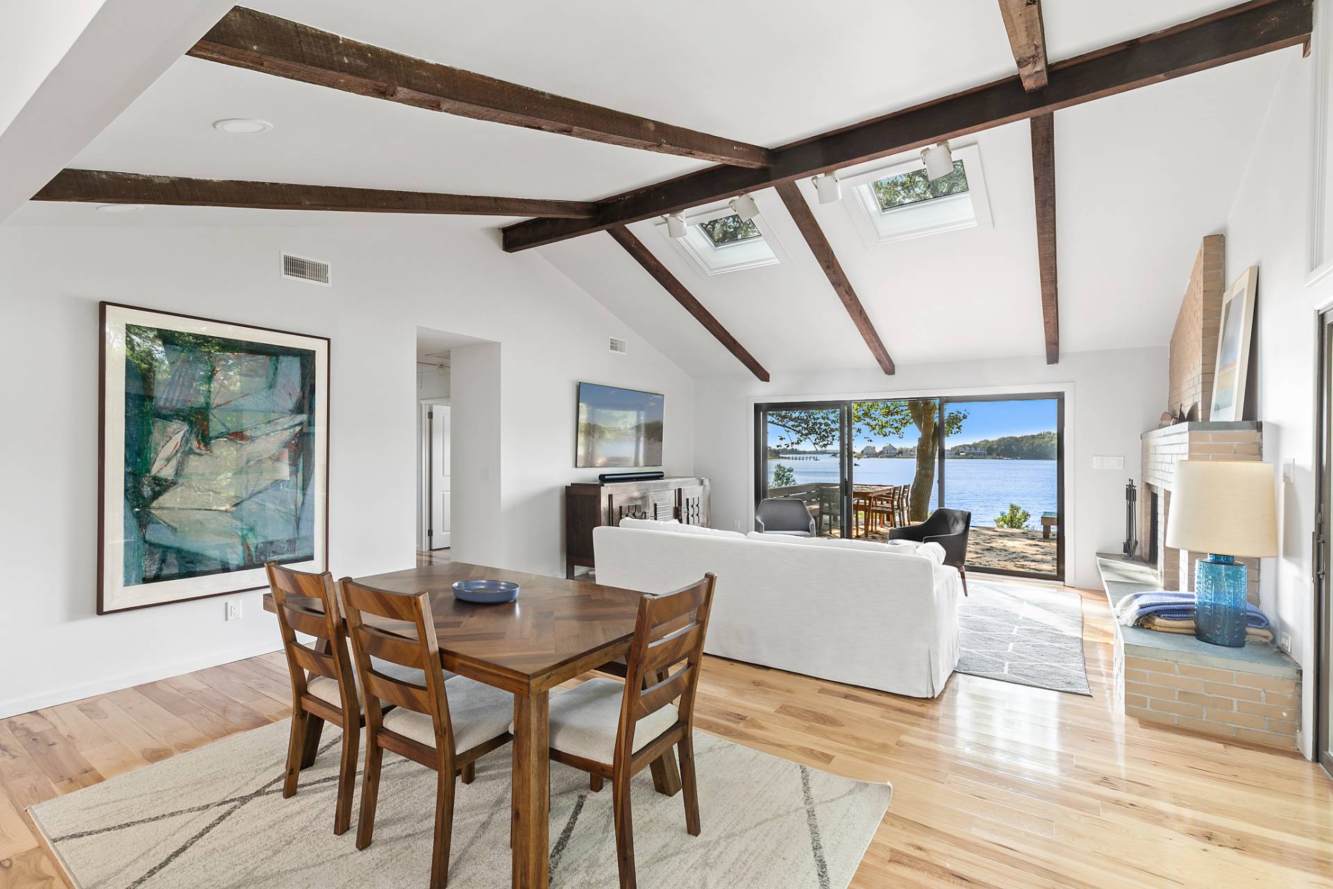 33 Bluff Point Road Sag Harbor, NY 11963 - Photo 4 of 20 a view of a dining room with furniture wooden floor and a large window