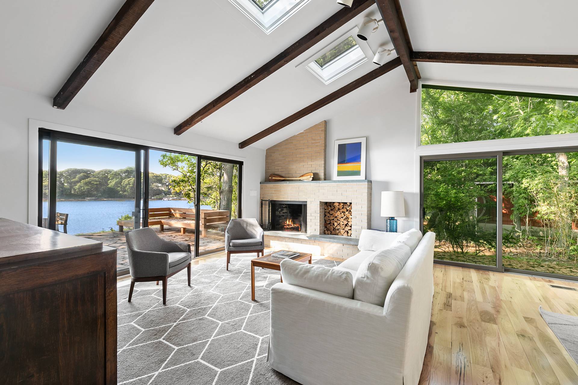 33 Bluff Point Road Sag Harbor, NY 11963 - Photo 6 of 20 a living room with furniture and a fireplace