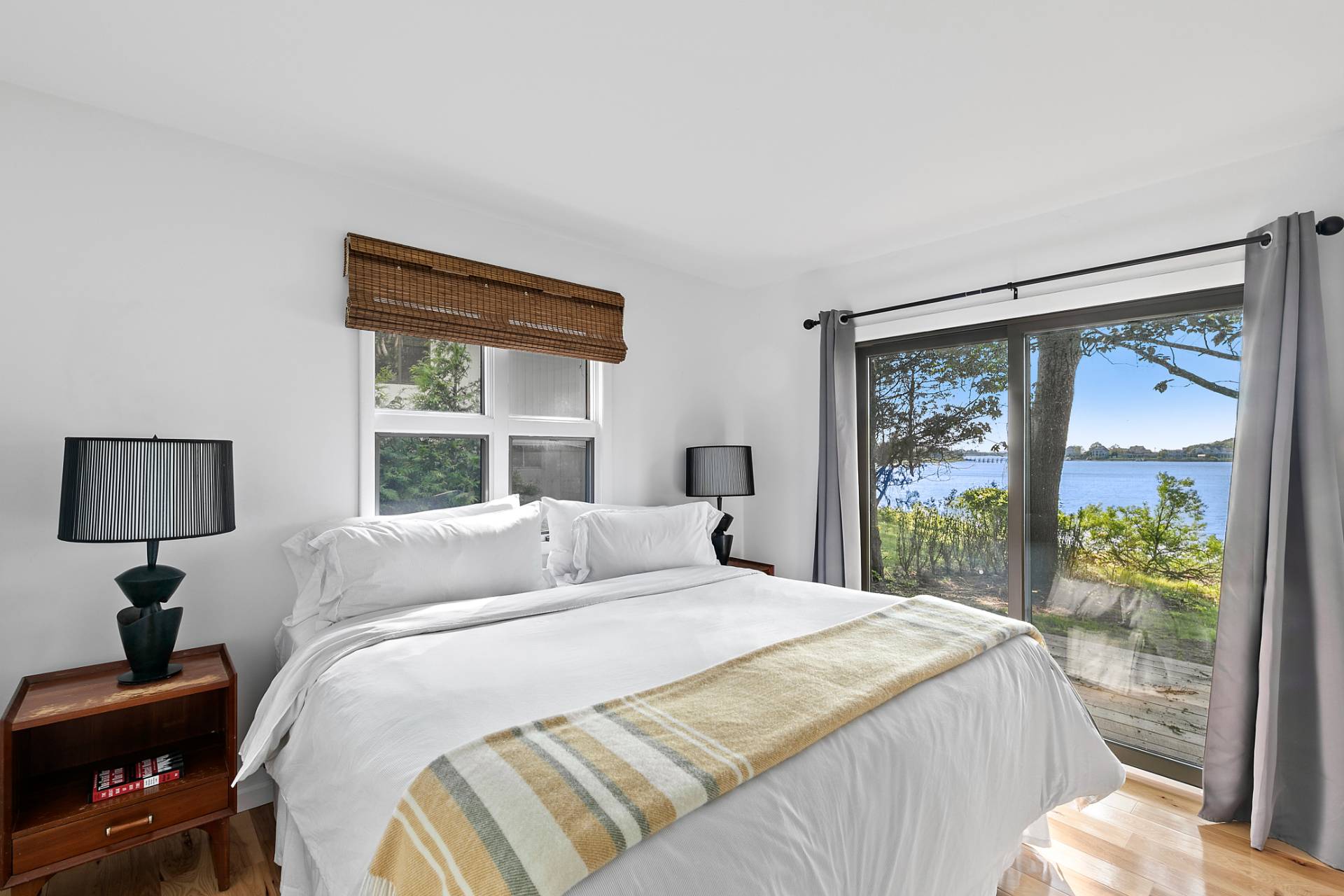 33 Bluff Point Road Sag Harbor, NY 11963 - Photo 7 of 20 a bedroom with a large bed and a window