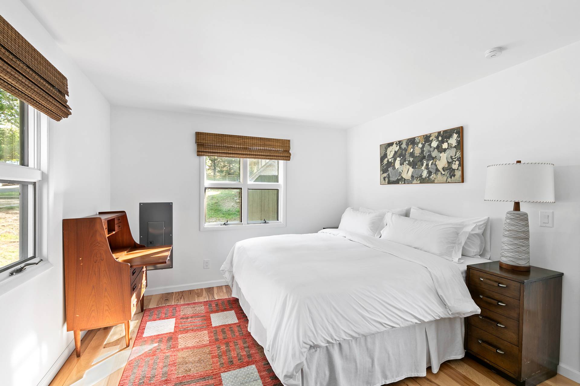 33 Bluff Point Road Sag Harbor, NY 11963 - Photo 9 of 20 a bedroom with a bed and wooden floor