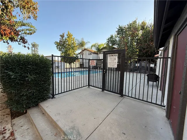 a view of a wrought iron fences in front of house