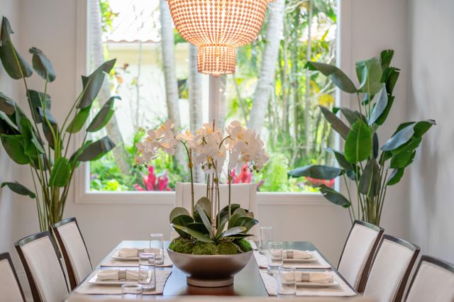a view of a dining room with furniture and a window