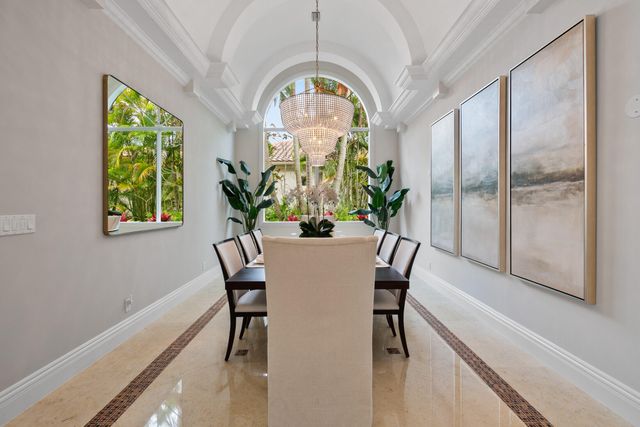 a spacious bedroom with a bed and a large window