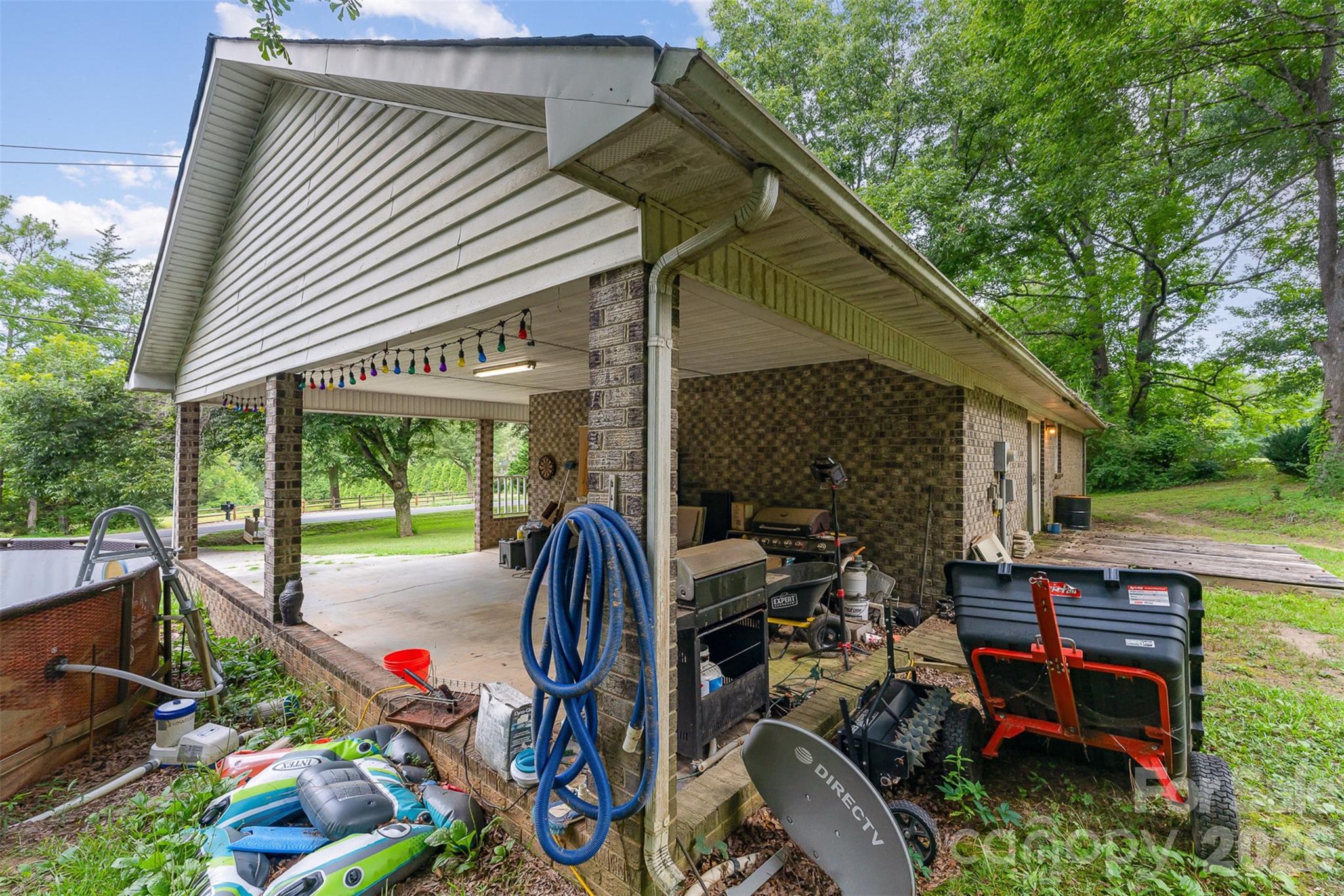 280 Dallas Spencer Mountain Road Gastonia, NC 28056 - Photo 16 of 19 a view of a patio with chairs and a table