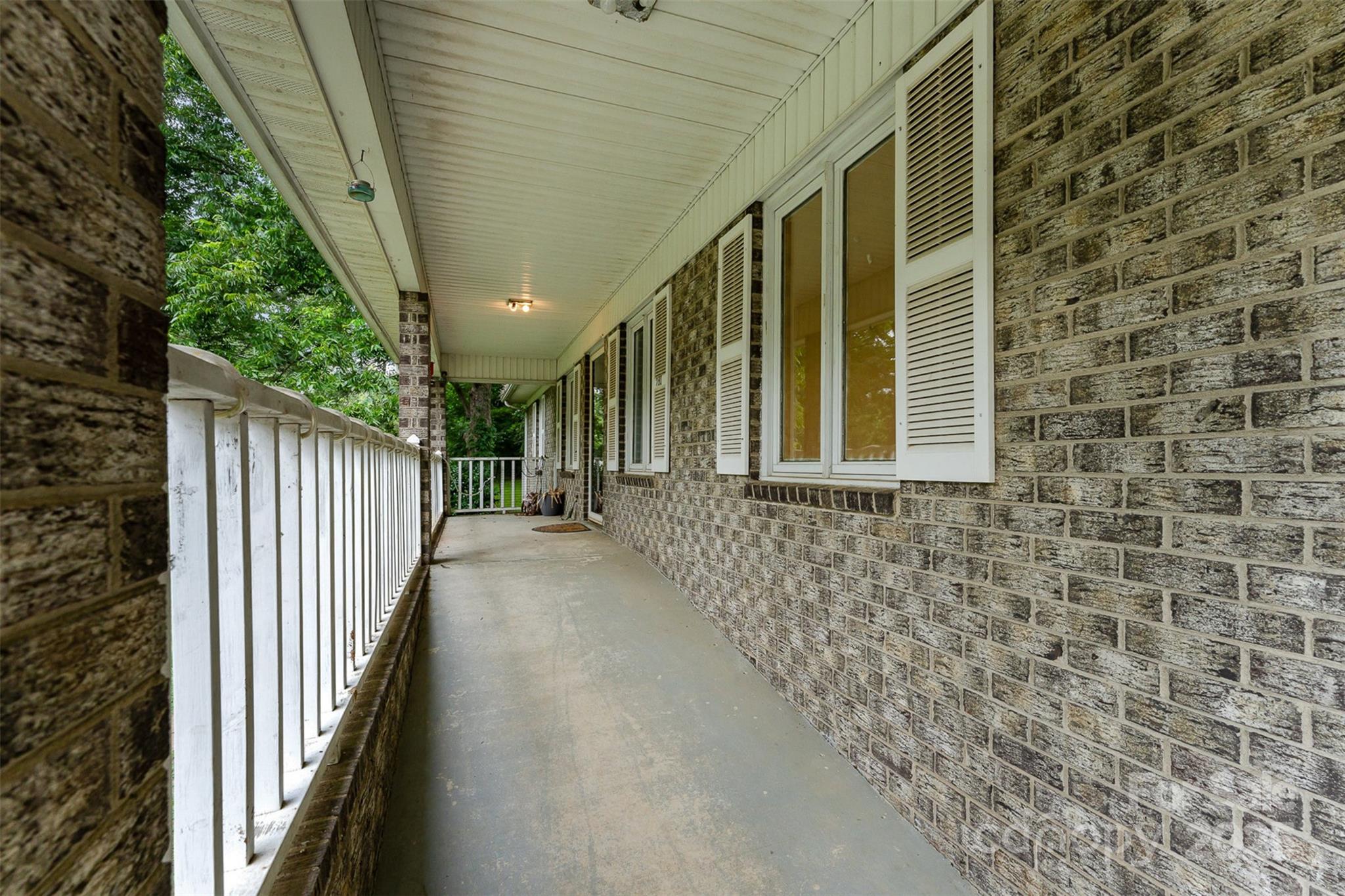 280 Dallas Spencer Mountain Road Gastonia, NC 28056 - Photo 3 of 19 a view of a pathway of a house with wooden fence