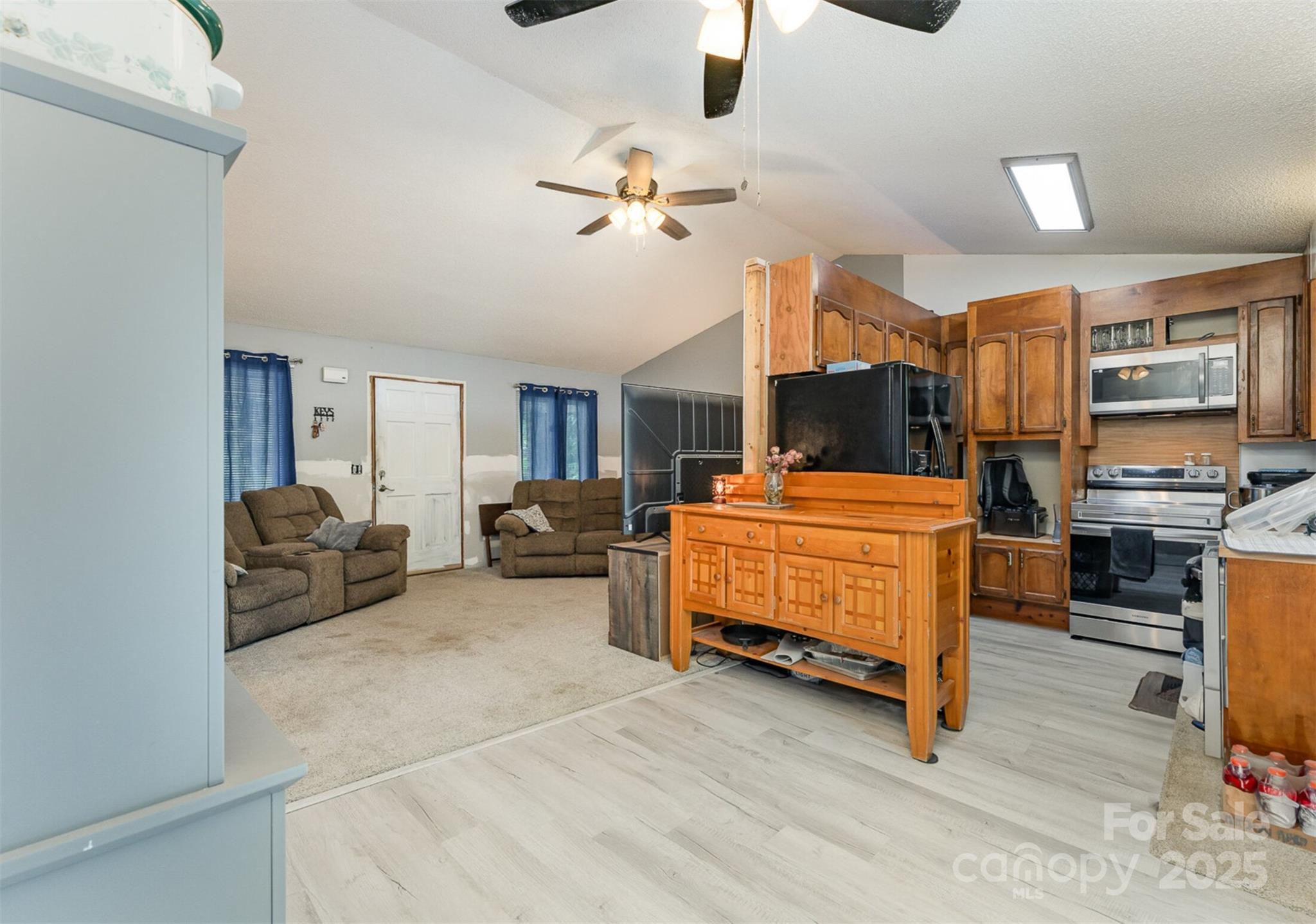 280 Dallas Spencer Mountain Road Gastonia, NC 28056 - Photo 8 of 19 a bedroom with furniture and a chandelier