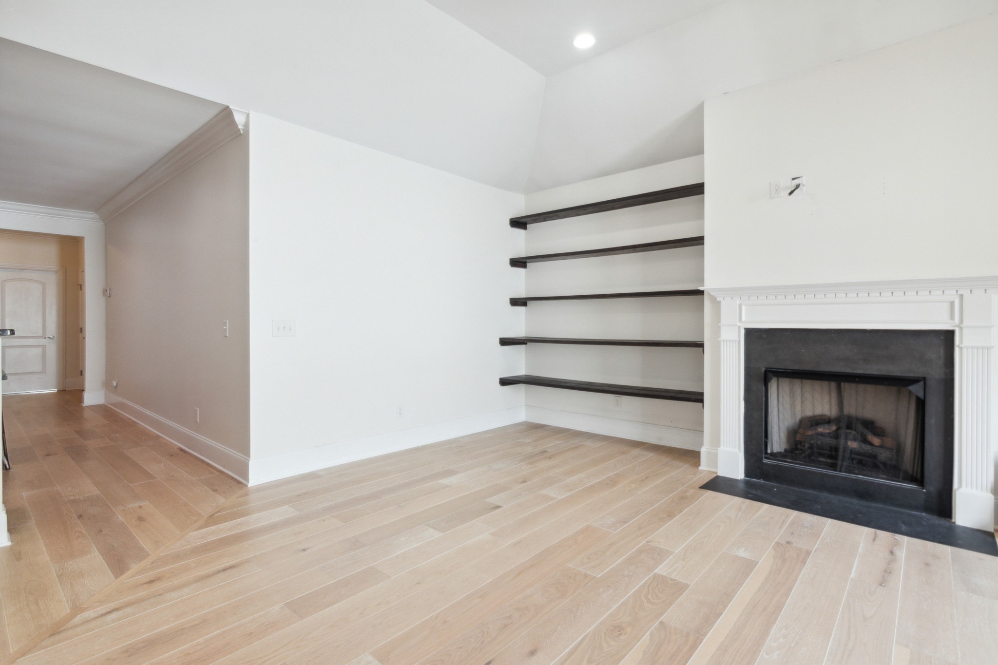 1024 Rochelle Avenue Thompson's Station, TN 37179 - Photo 13 of 37 a view of an empty room with a fireplace and a window