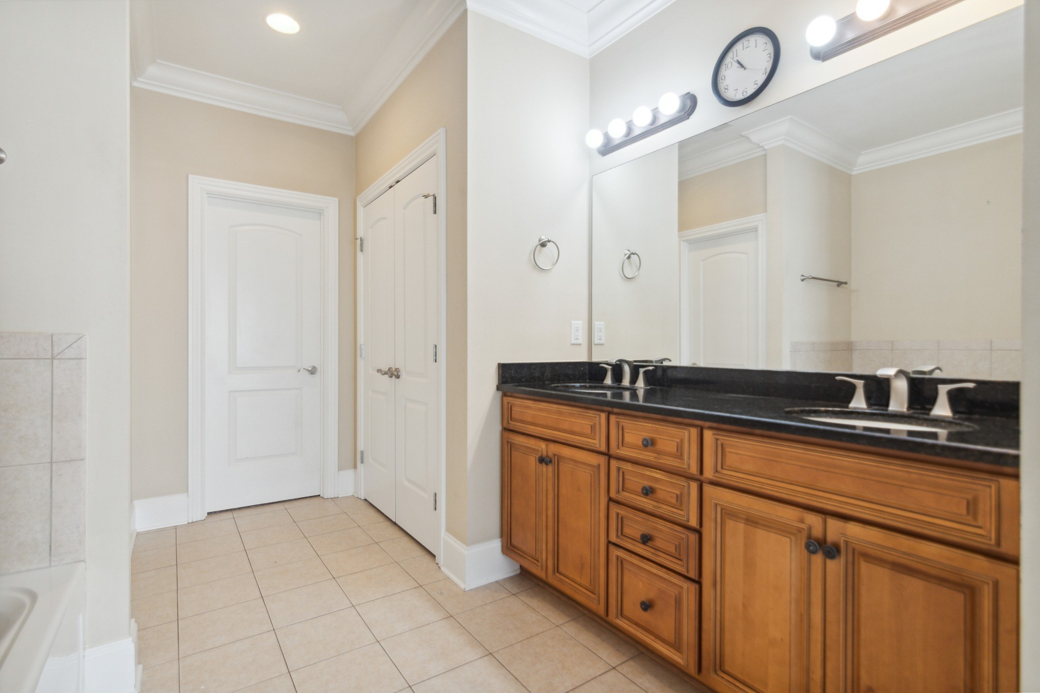 1024 Rochelle Avenue Thompson's Station, TN 37179 - Photo 21 of 37 a bathroom with granite countertop a sink and a mirror