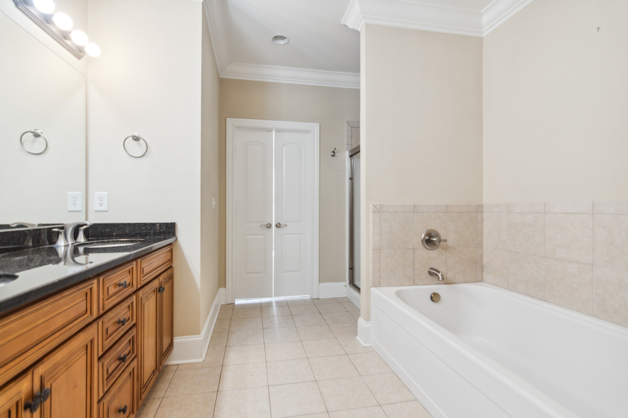 1024 Rochelle Avenue Thompson's Station, TN 37179 - Photo 22 of 37 a spacious bathroom with a tub sink and mirror