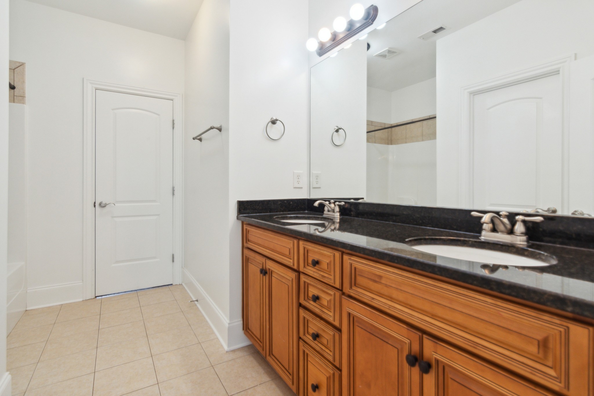 1024 Rochelle Avenue Thompson's Station, TN 37179 - Photo 27 of 37 a bathroom with a sink and a mirror