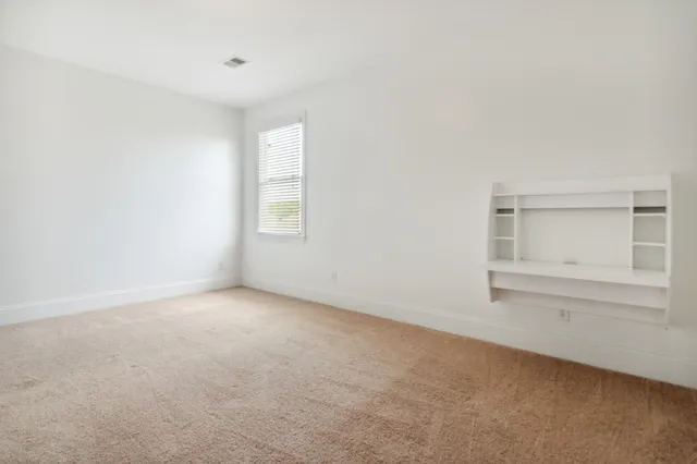 a utility room with cabinets washer and dryer