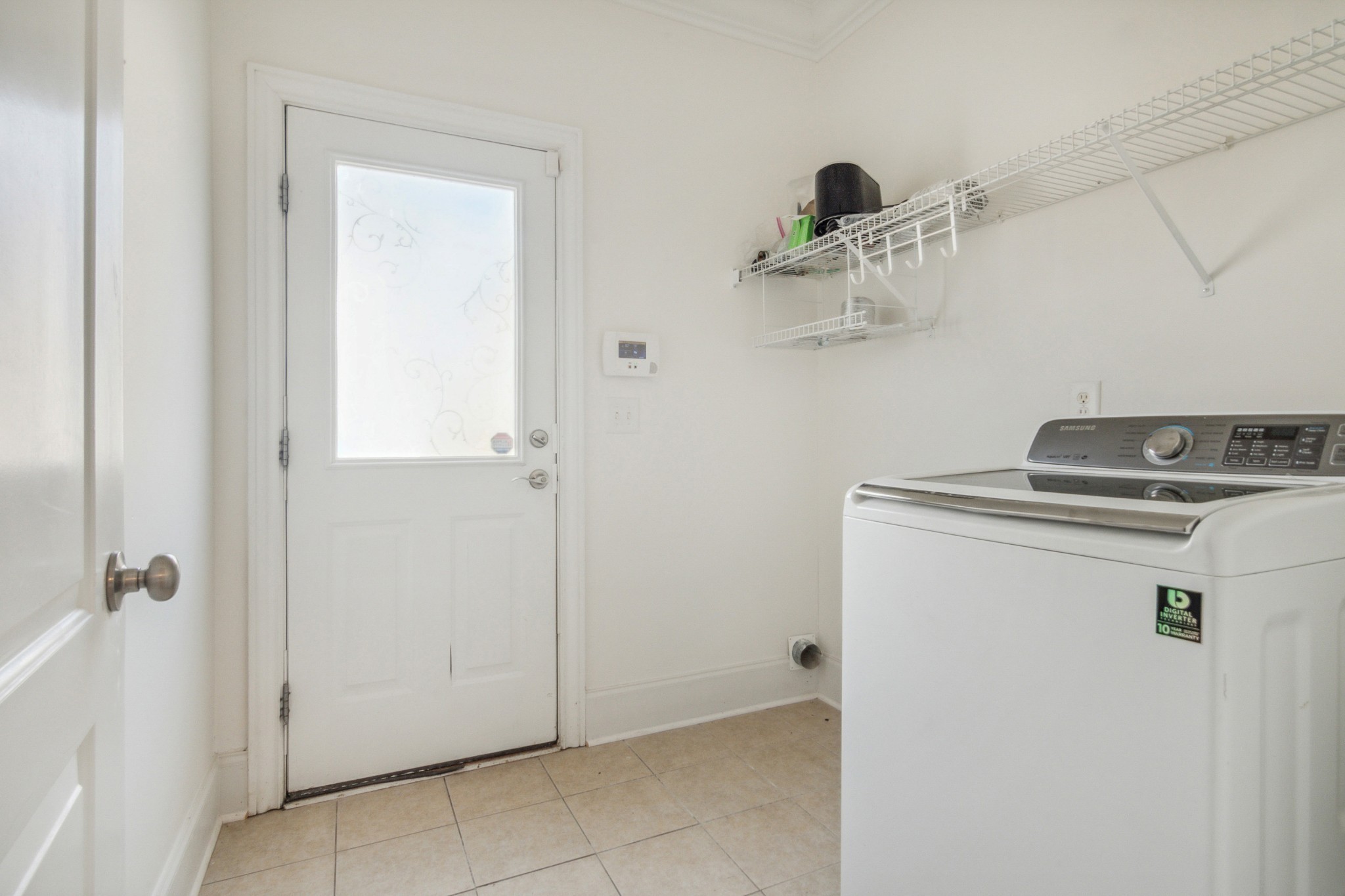 1024 Rochelle Avenue Thompson's Station, TN 37179 - Photo 34 of 37 a utility room with cabinets washer and dryer