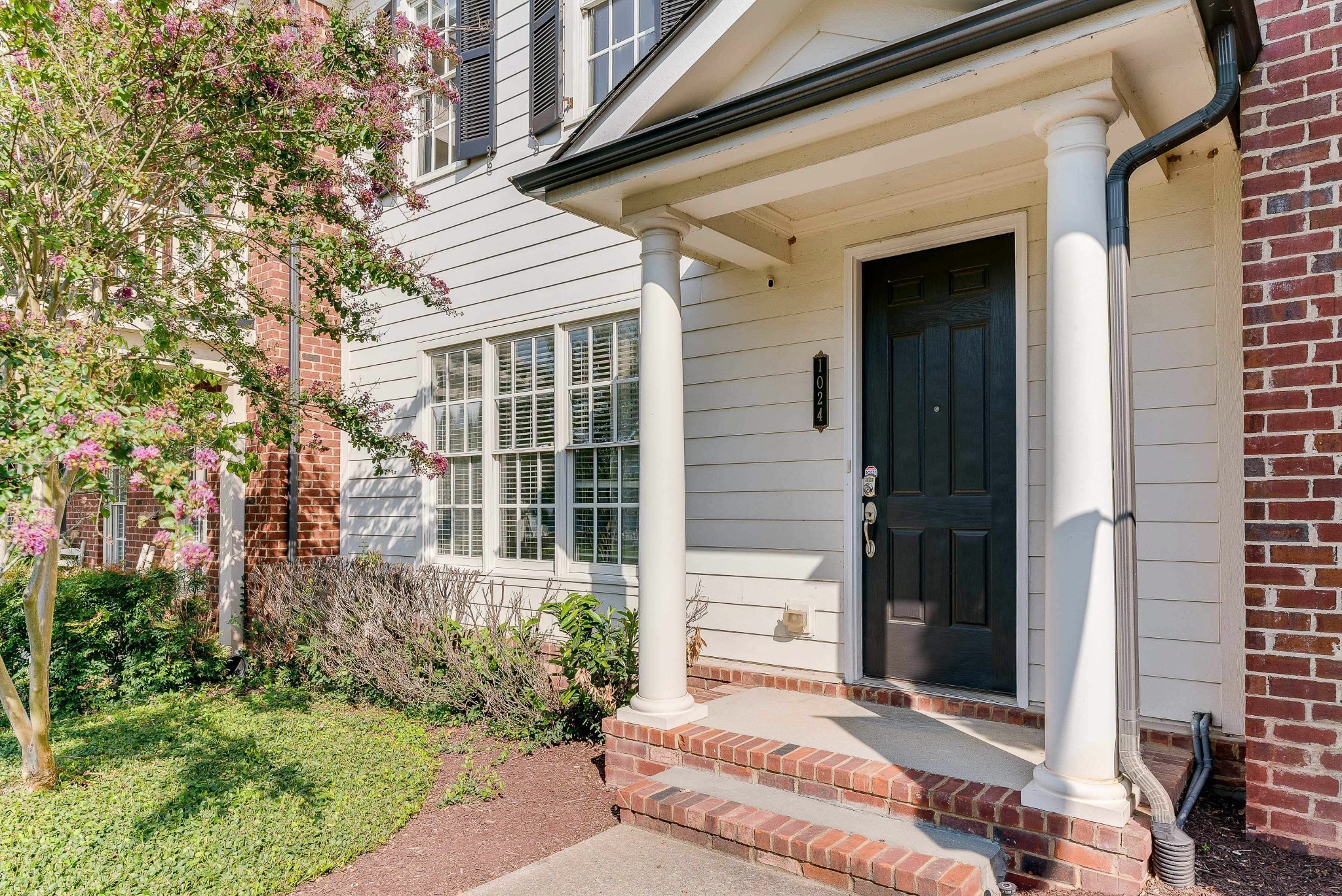 1024 Rochelle Avenue Thompson's Station, TN 37179 - Photo 4 of 37 a front view of a house with a yard