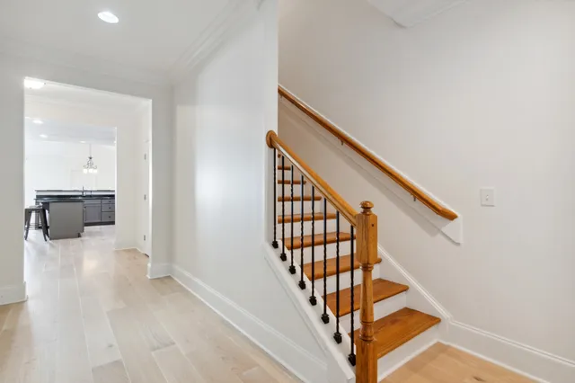 a view of a hallway with wooden floor