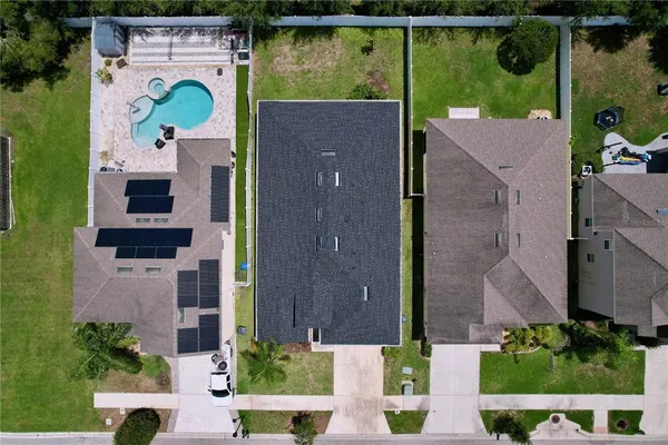 a living room with furniture kitchen view and a fireplace