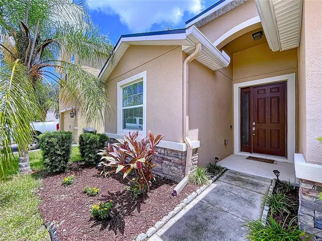 a view of a dining room with furniture and windows