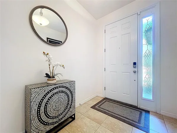 a view of a dining room with furniture and window