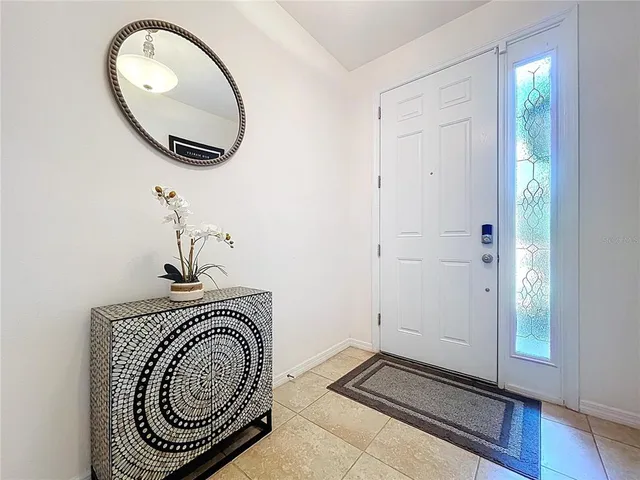 a view of a dining room with furniture and window