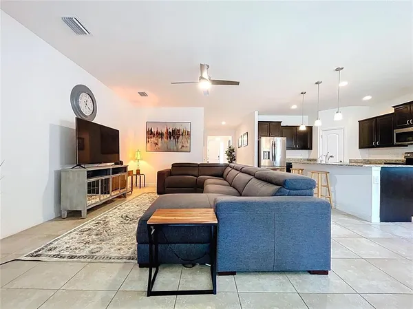 a kitchen with granite countertop stainless steel appliances and sink