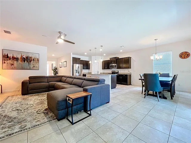 a kitchen with granite countertop cabinets and stove top oven