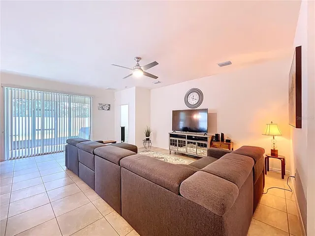 a livingroom with workspace and a couch