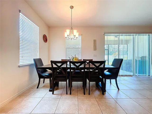 a spacious bedroom with a bed and a cabinets