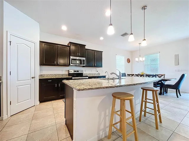 a bedroom with a bed and a television