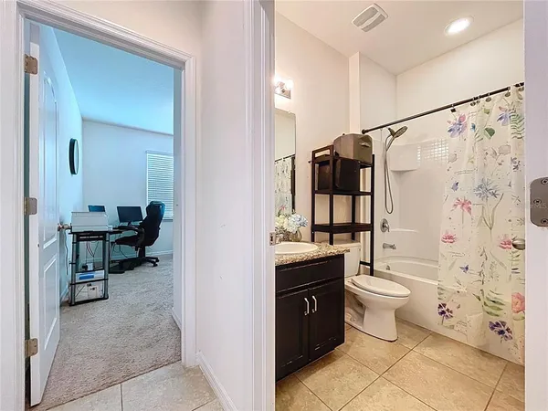a utility room with sink dryer and washer