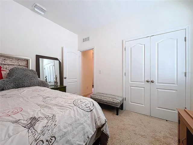 a front view of a house with a garden and patio