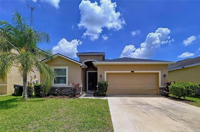 an aerial view of a house with a garden