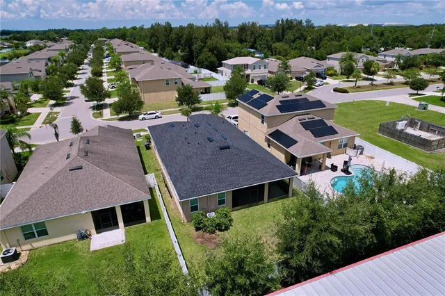 a front view of house with yard and garage
