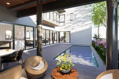 a lobby with furniture and floor to ceiling window